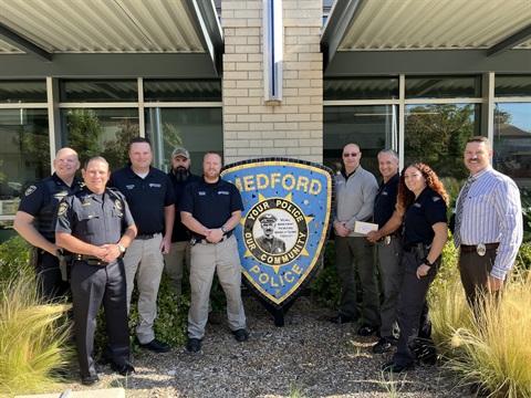 doTERRA and MPD posing for picture outside of MPD.jpg